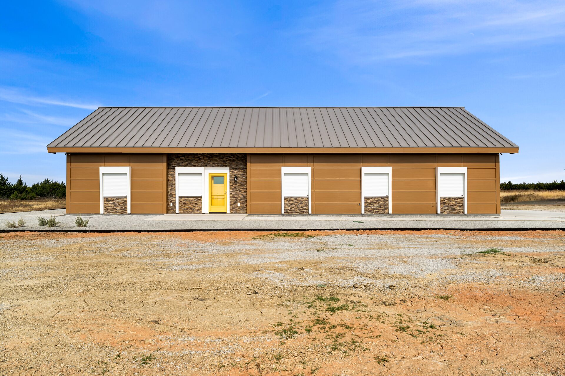 Zephyr custom build barndominium exterior with metal roof front by RBCS Inc passive home builder in North Texas